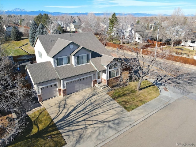 view of front of property featuring a mountain view and a garage