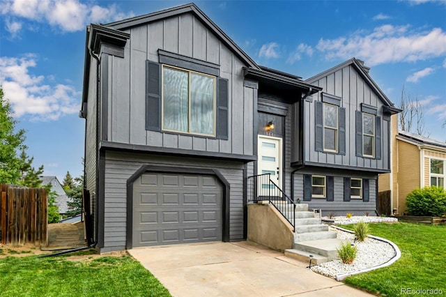 19661 E Girard Ave, Aurora, CO 80013 - view of front facade with board and batten siding, an attached garage, and driveway