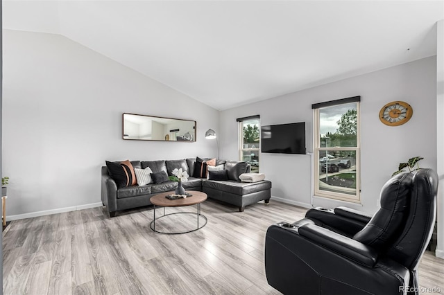 19661 E Girard Ave, Aurora, CO 80013 - living room featuring vaulted ceiling, wood finished floors, and baseboards