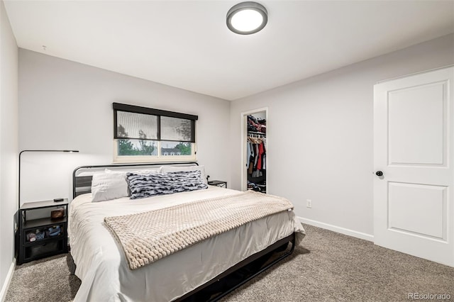 19661 E Girard Ave, Aurora, CO 80013 - bedroom with carpet flooring, baseboards, a walk in closet, and a closet