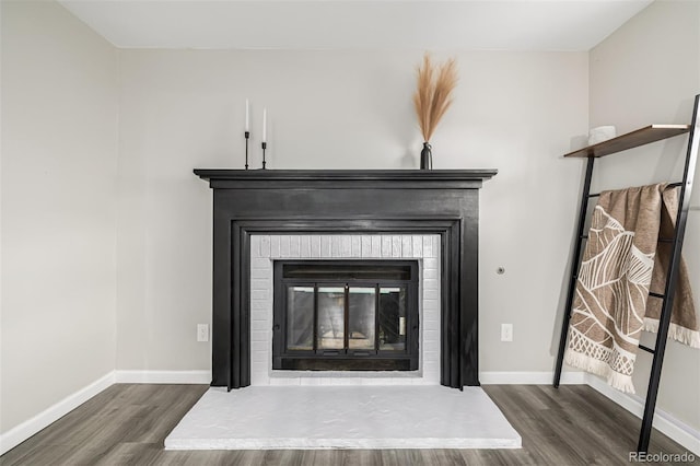19661 E Girard Ave, Aurora, CO 80013 - detailed view of a fireplace, wood finished floors, and baseboards