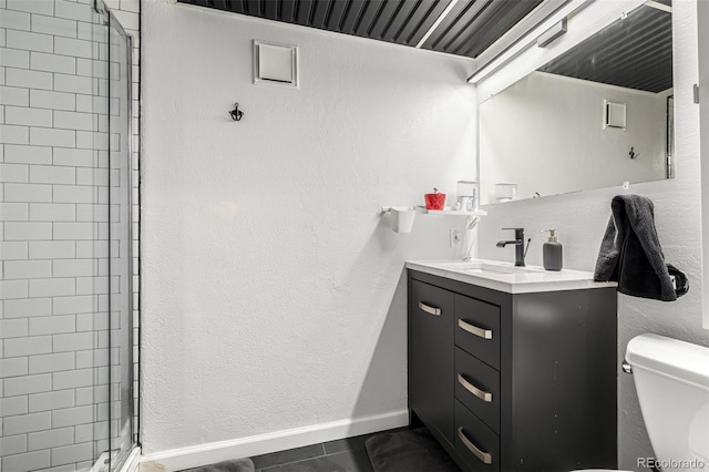 19661 E Girard Ave, Aurora, CO 80013 - full bath with toilet, vanity, a stall shower, and baseboards