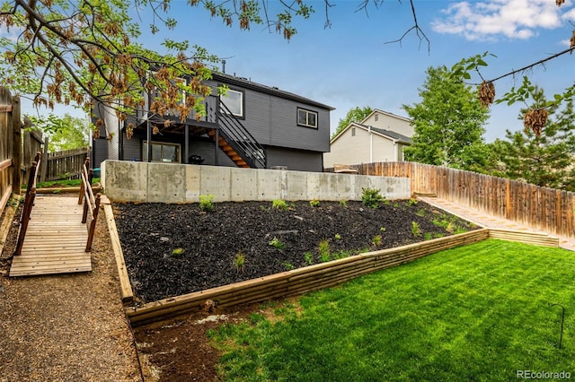 19661 E Girard Ave, Aurora, CO 80013 - view of yard featuring stairway and a deck