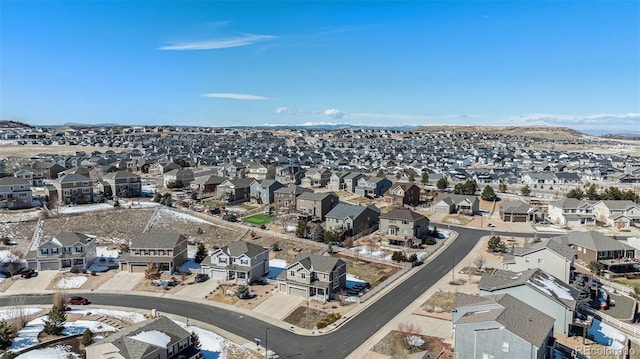 birds eye view of property with a residential view