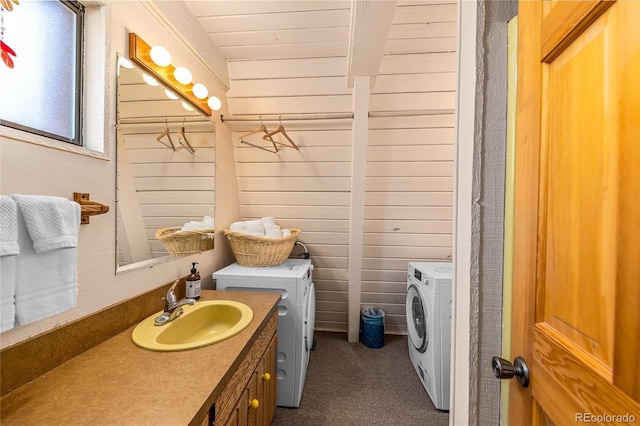 771 Spruce Rd, Cimarron, CO 81220 - bathroom featuring washer and clothes dryer, vanity, and wood ceiling