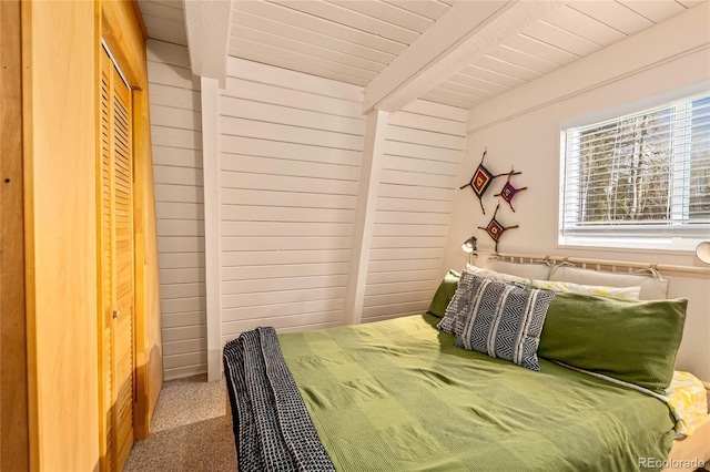771 Spruce Rd, Cimarron, CO 81220 - carpeted bedroom with a wooden ceiling with exposed beams
