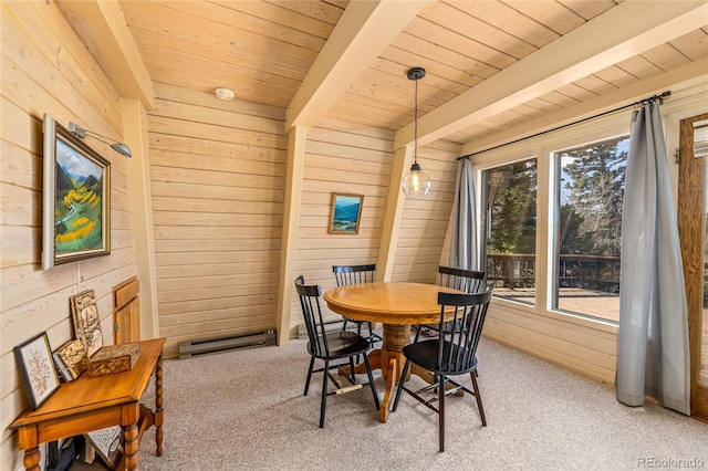 771 Spruce Rd, Cimarron, CO 81220 - carpeted dining room featuring wood walls, a wooden ceiling with exposed beams, and a baseboard radiator