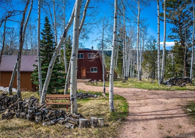 771 Spruce Rd, Cimarron, CO 81220 - view of front of home with an outdoor structure and a metal roof