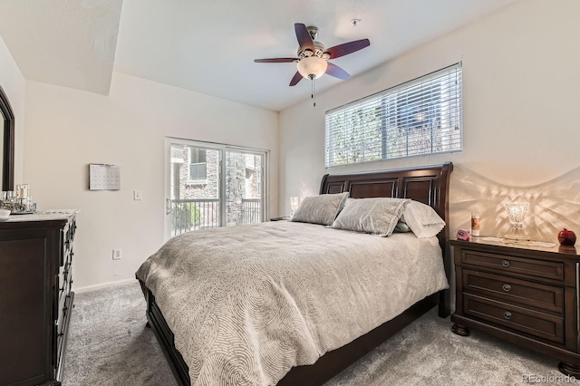 carpeted bedroom featuring ceiling fan, baseboards, and access to exterior