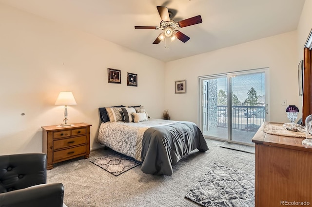 bedroom featuring light colored carpet, ceiling fan, and access to outside