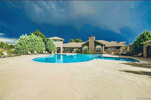 pool with a patio area