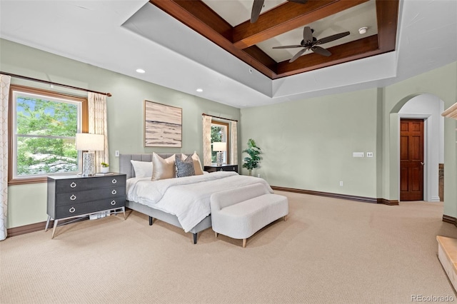 bedroom with ceiling fan, multiple windows, and carpet floors