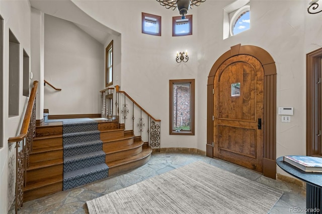 entrance foyer with an inviting chandelier and a high ceiling