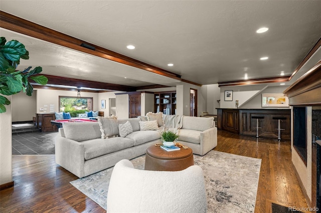 living room featuring dark hardwood / wood-style flooring and beamed ceiling