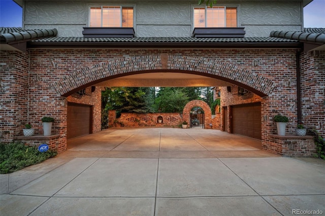 exterior space featuring a garage and driveway