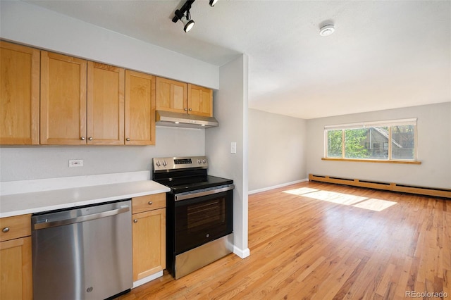 1144 N Ogden St Unit 304, Denver, CO 80218 - kitchen with stainless steel appliances, under cabinet range hood, light wood-style flooring, light countertops, and open floor plan