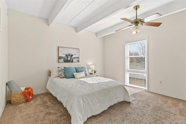 carpeted bedroom featuring ceiling fan, lofted ceiling with beams, and a textured ceiling