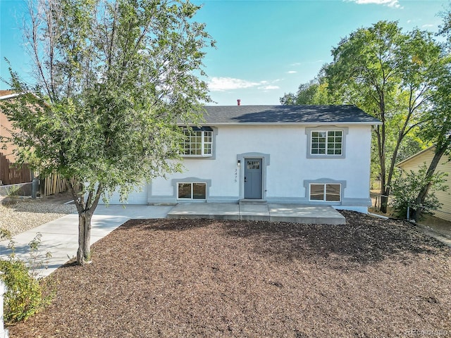 raised ranch featuring a patio