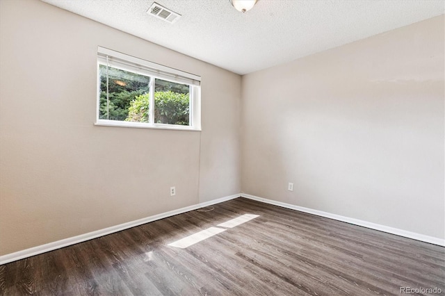 16359 W 10th Ave Unit 2, Golden, CO 80401 - spare room with wood finished floors and a textured ceiling