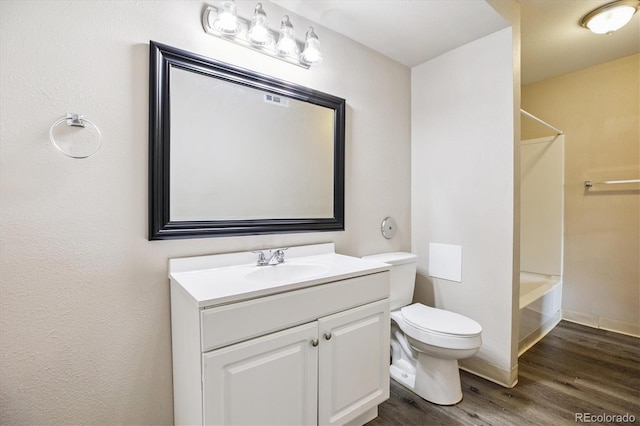 16359 W 10th Ave Unit 2, Golden, CO 80401 - bathroom with vanity, wood finished floors, and bathtub / shower combination