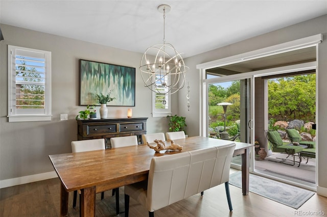5608 Raintree Dr, Parker, CO 80134 - dining space with plenty of natural light, a chandelier, baseboards, and wood finished floors