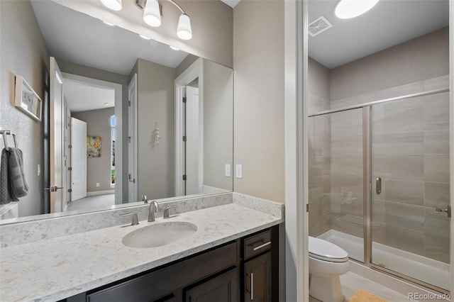 5608 Raintree Dr, Parker, CO 80134 - bathroom with vanity, a shower stall, and toilet