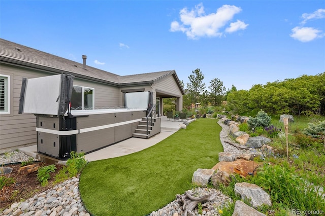 5608 Raintree Dr, Parker, CO 80134 - view of green lawn with a hot tub and a patio area