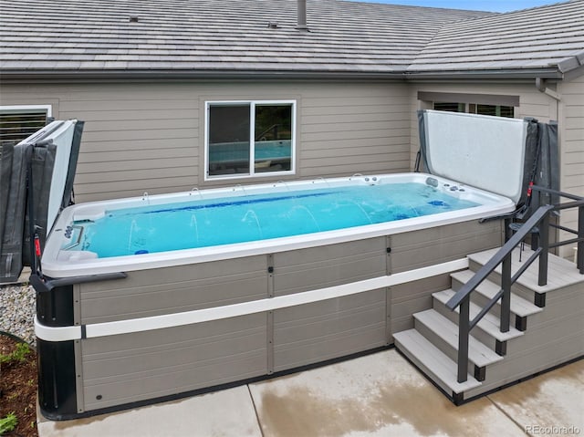 5608 Raintree Dr, Parker, CO 80134 - view of swimming pool with a hot tub