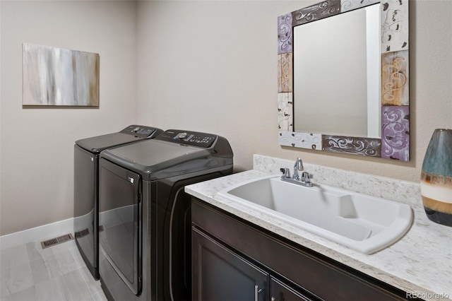 5608 Raintree Dr, Parker, CO 80134 - laundry area with washer and dryer, baseboards, and cabinet space