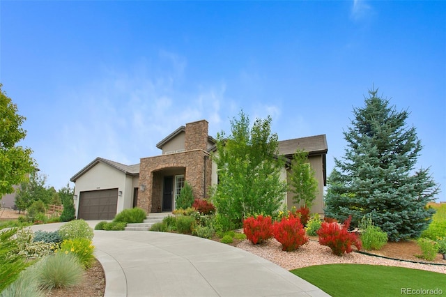 5608 Raintree Dr, Parker, CO 80134 - view of front facade featuring stone siding, an attached garage, driveway, and stucco siding