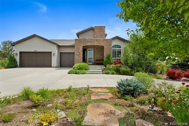 5608 Raintree Dr, Parker, CO 80134 - view of front of home with a garage, concrete driveway, and stucco siding