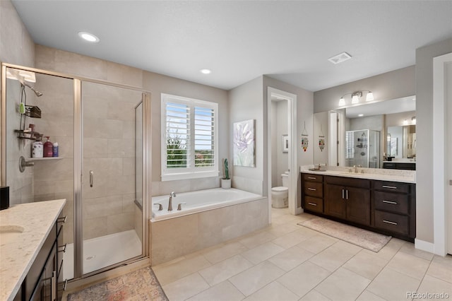 5608 Raintree Dr, Parker, CO 80134 - full bath with vanity, a garden tub, a stall shower, tile patterned floors, and recessed lighting