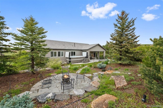 5608 Raintree Dr, Parker, CO 80134 - back of property with a fire pit, a patio, and roof with shingles