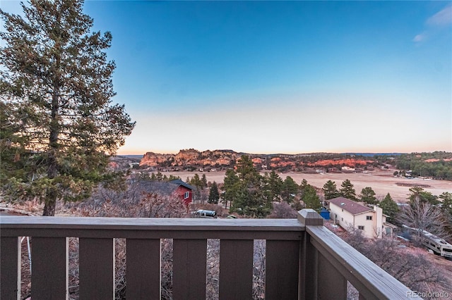 view of balcony at dusk