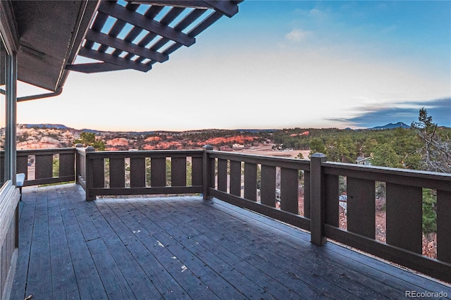 wooden deck with a mountain view