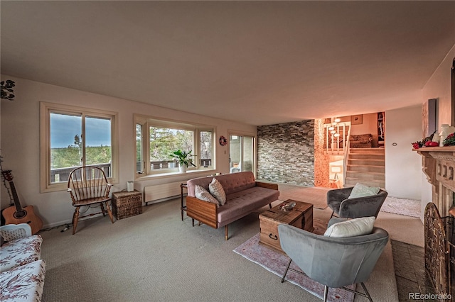 living room with carpet, a fireplace, and stairway