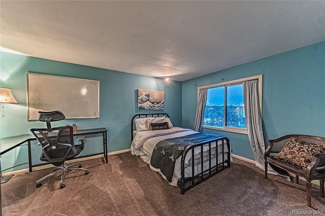 bedroom featuring carpet, a textured ceiling, and baseboards