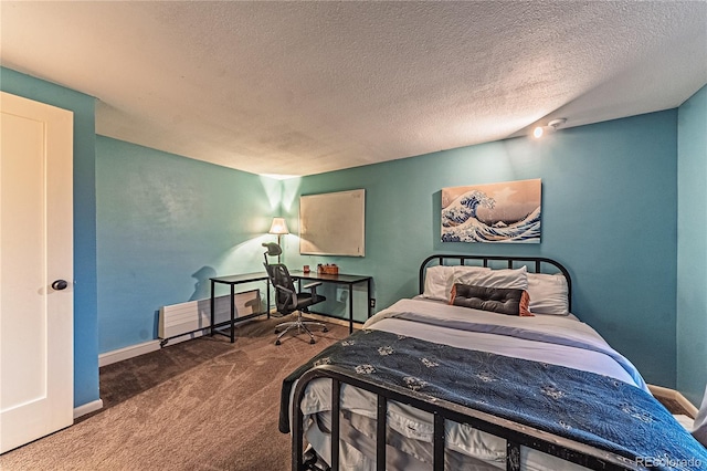 bedroom with carpet floors, a textured ceiling, and baseboards