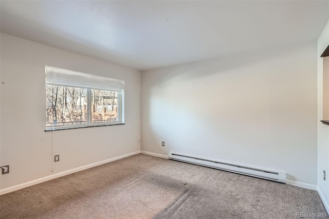 carpeted empty room featuring baseboard heating