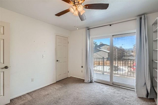 spare room with carpet floors and ceiling fan