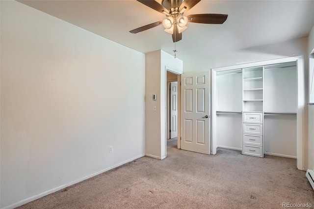 unfurnished bedroom with light carpet, a closet, baseboard heating, and ceiling fan