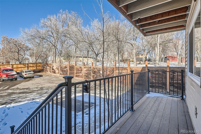 view of snow covered deck