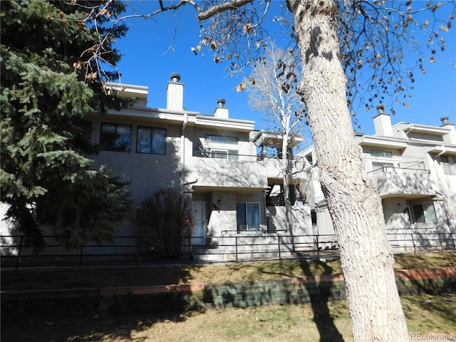 back of property featuring a chimney