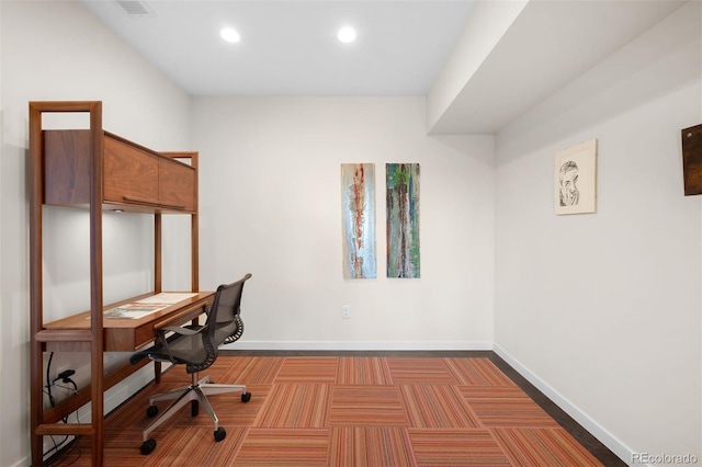 unfurnished office with carpet floors, visible vents, baseboards, and recessed lighting