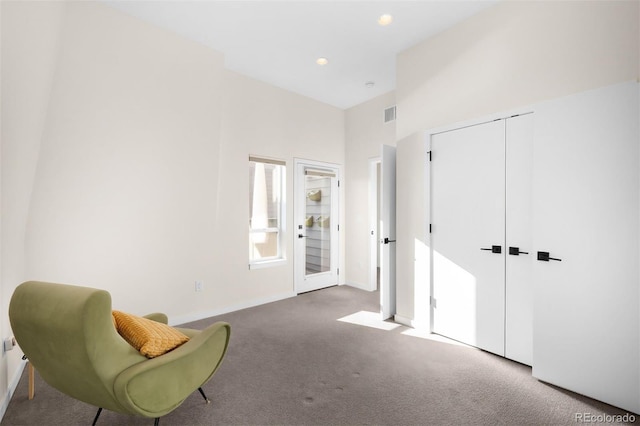 sitting room with baseboards, carpet floors, visible vents, and recessed lighting