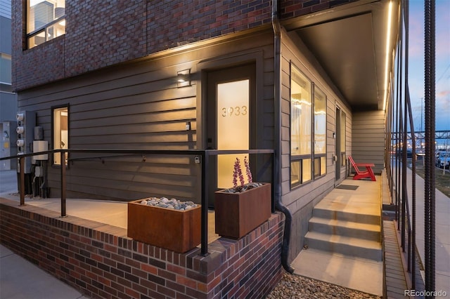 view of side of property with brick siding