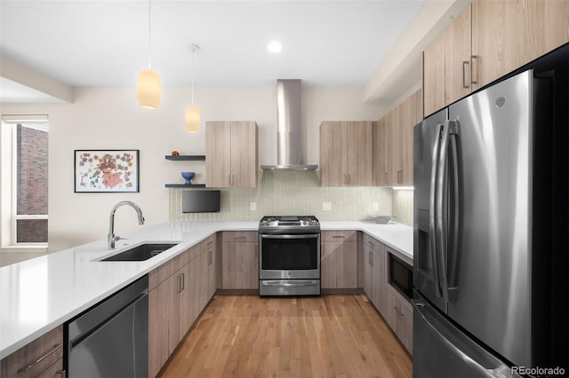 kitchen featuring wall chimney exhaust hood, modern cabinets, appliances with stainless steel finishes, open shelves, and a sink