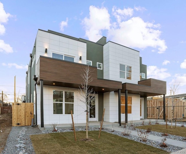 modern home with a front lawn