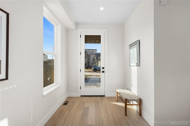 entryway with recessed lighting, light wood-type flooring, baseboards, and visible vents