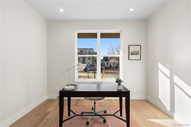 home office featuring recessed lighting, light wood-style floors, and baseboards